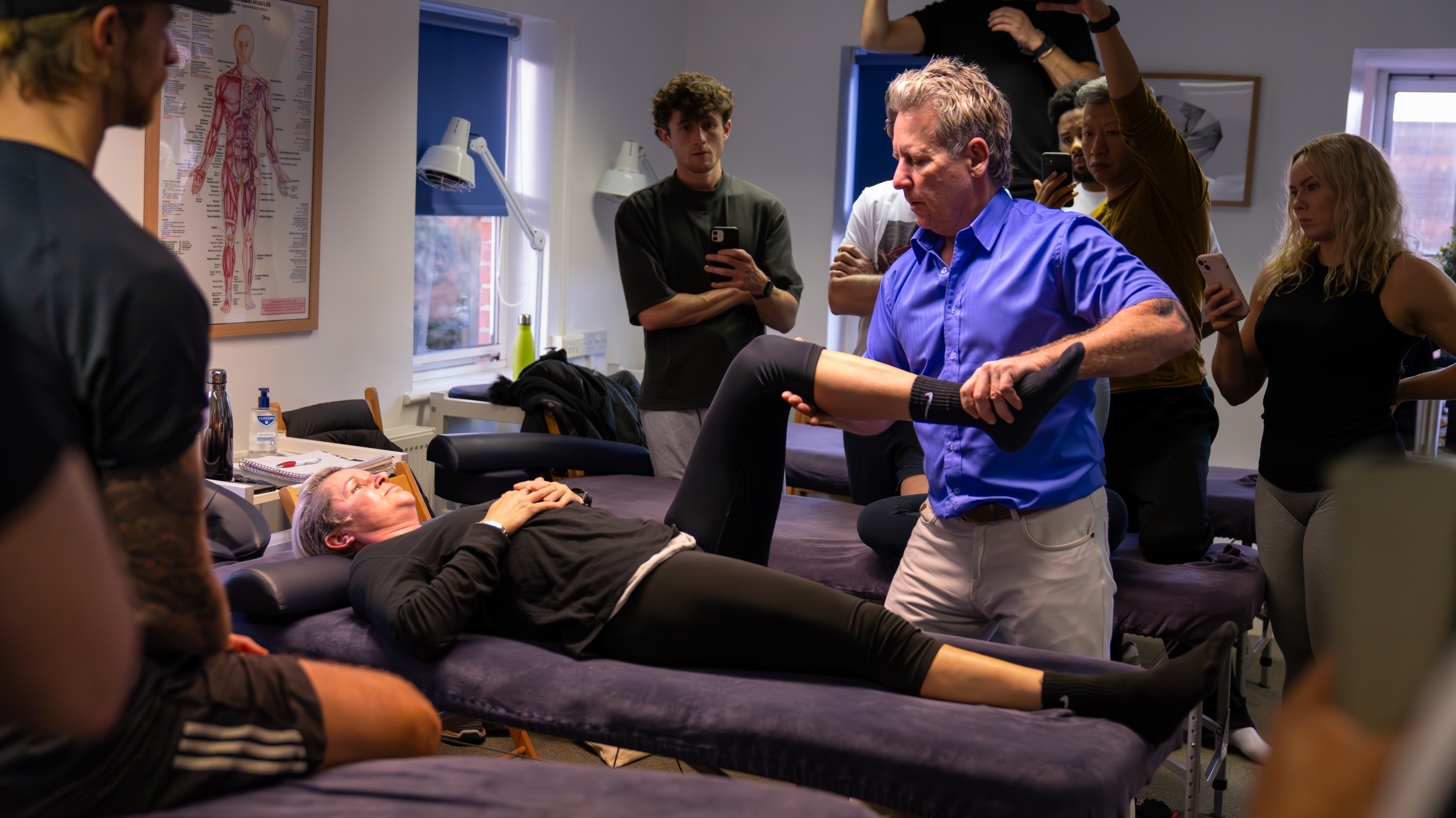 John Gibbons teaching spinal mobilisation in a clinical course
